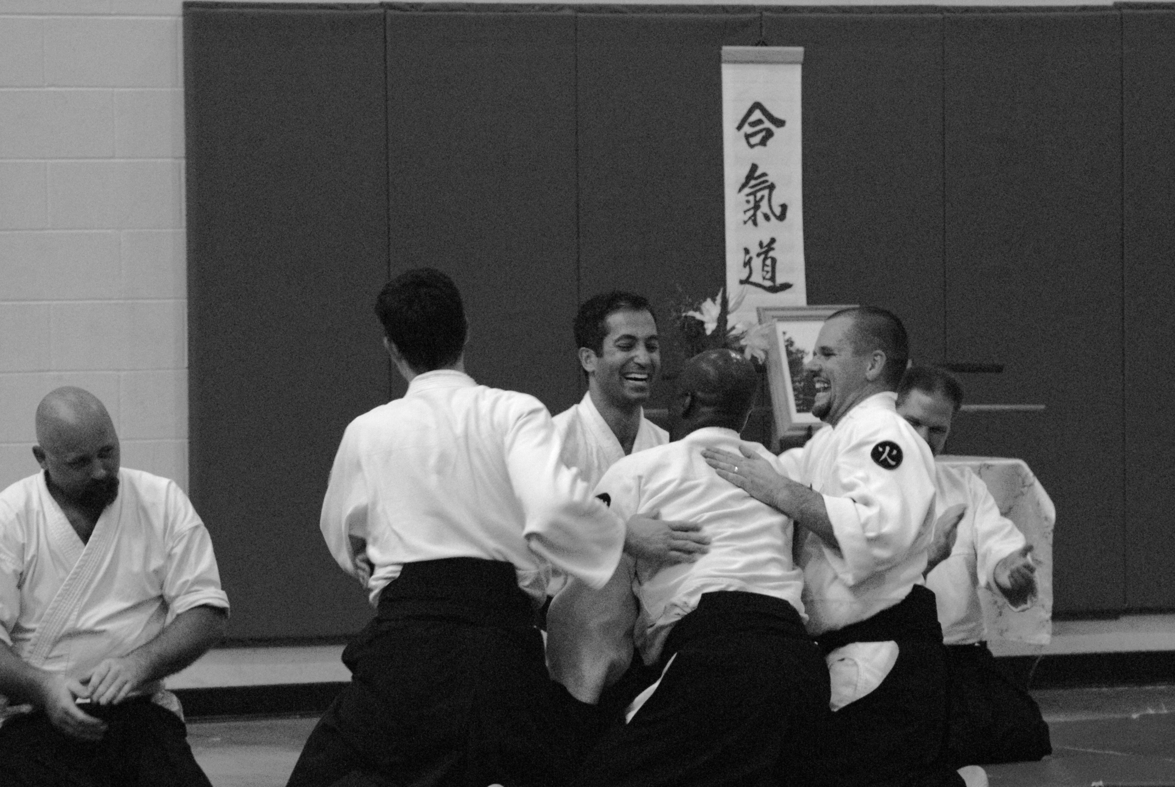 Aikido practitioners drilling and sparring during Saturday training